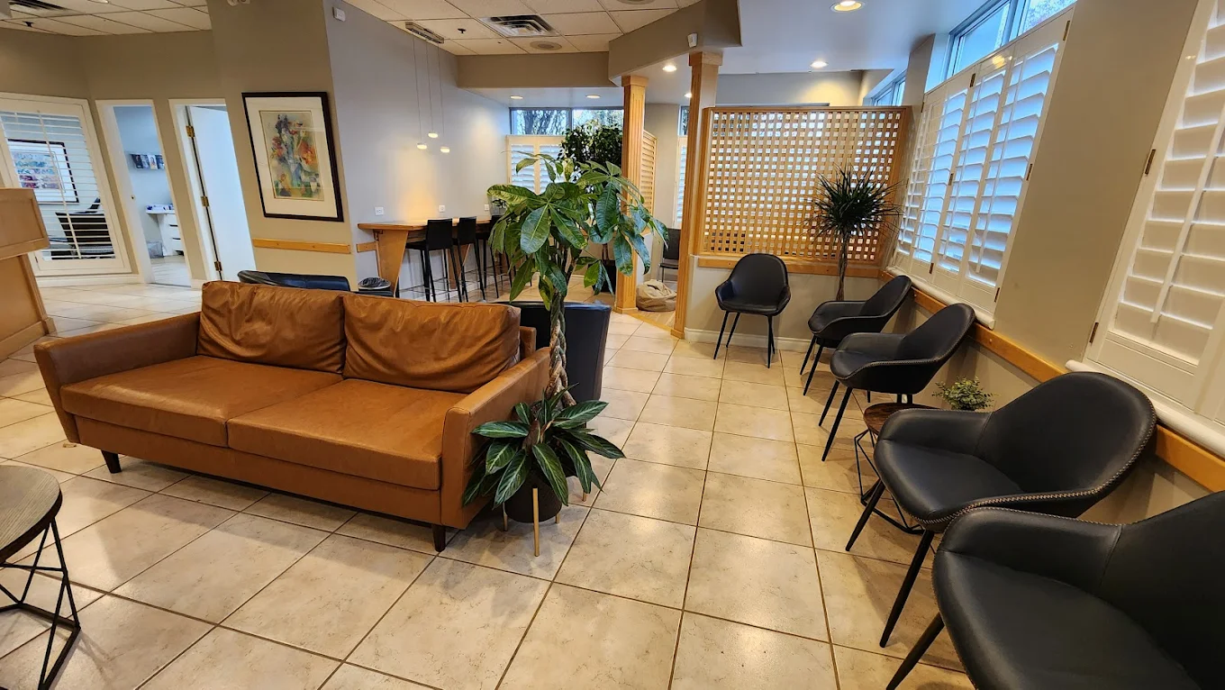 Modern treatment room with dental chairs and equipment